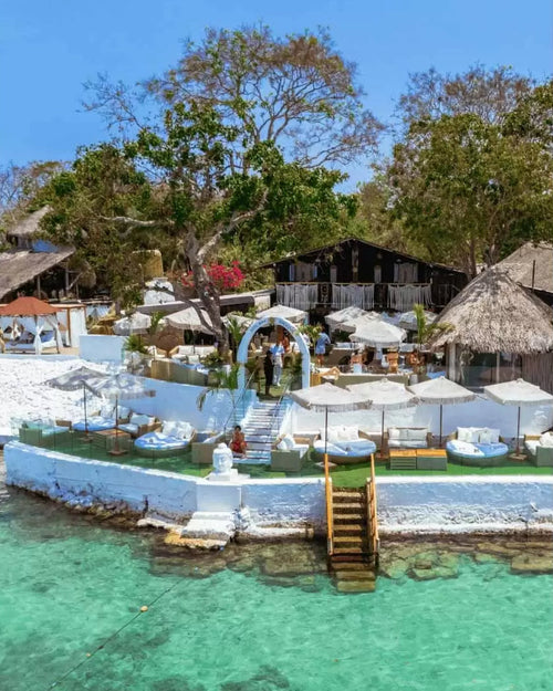 Tropical resort with pool and cabanas by the water